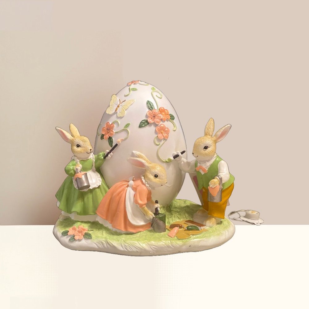Hand Painted Pastel Bunnies Painting an Easter Egg